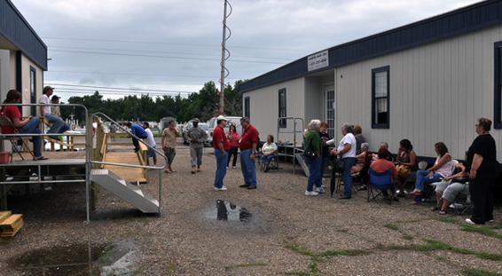 Fishermen's families line up outside a Catholic Charities aid station. Families affected by the spill are at an increased risk of psychological trauma. (Geoff Livingston via flickr)
